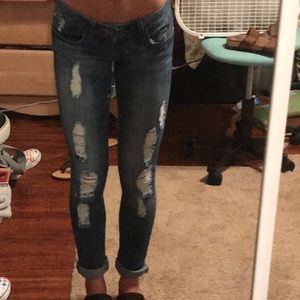 Distressed blue skinny jeans